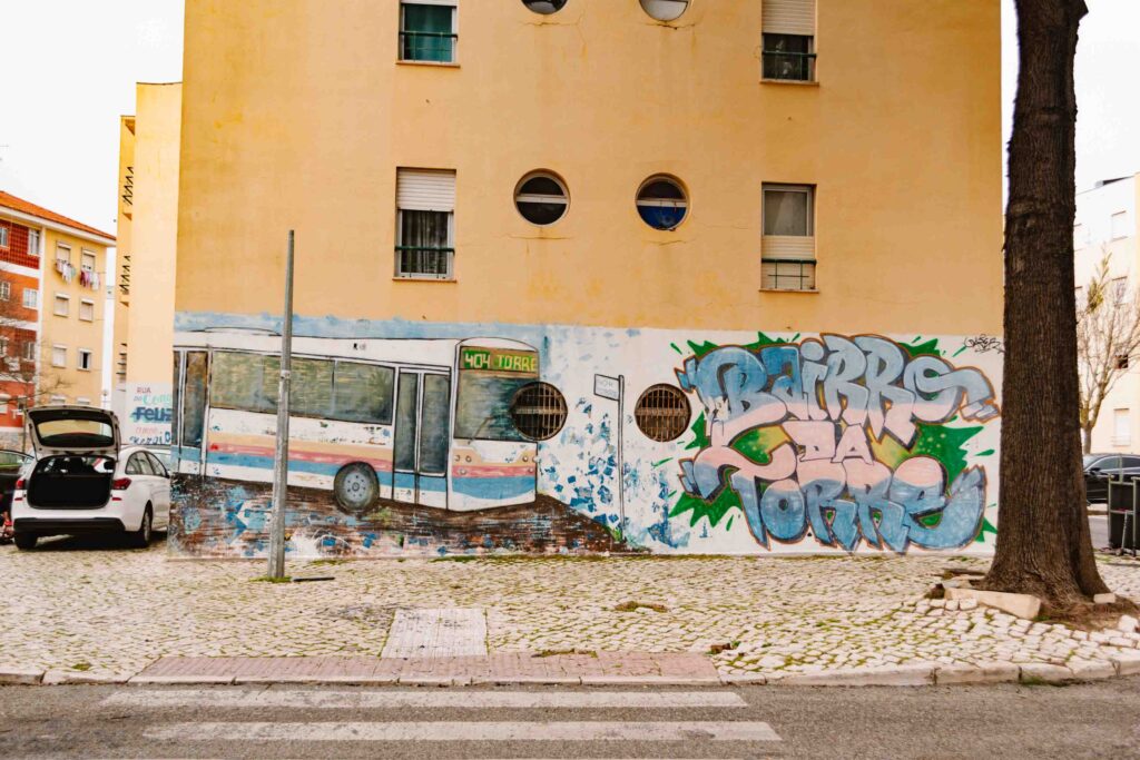 Street art in Torre, Portugal depicting a local bus line which had its service stopped when the neighborhood was dangerous, but after this street art festival revamping the neighborhood's status, the bus service was resumed
