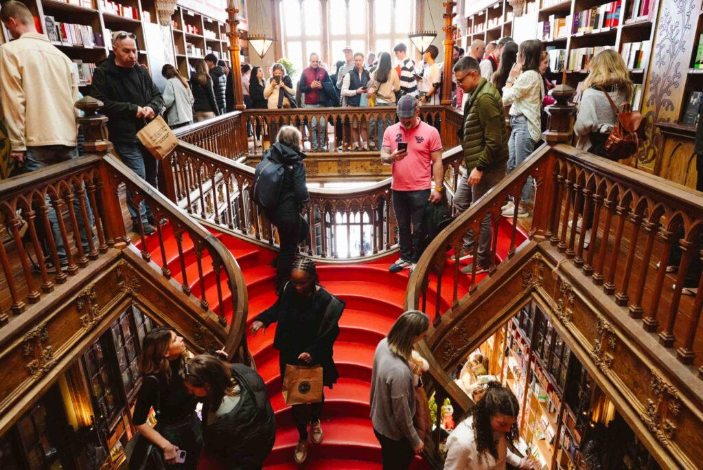 Interior of Livraria Lello, the world's most beautiful bookstore, with mid-afternoon crows