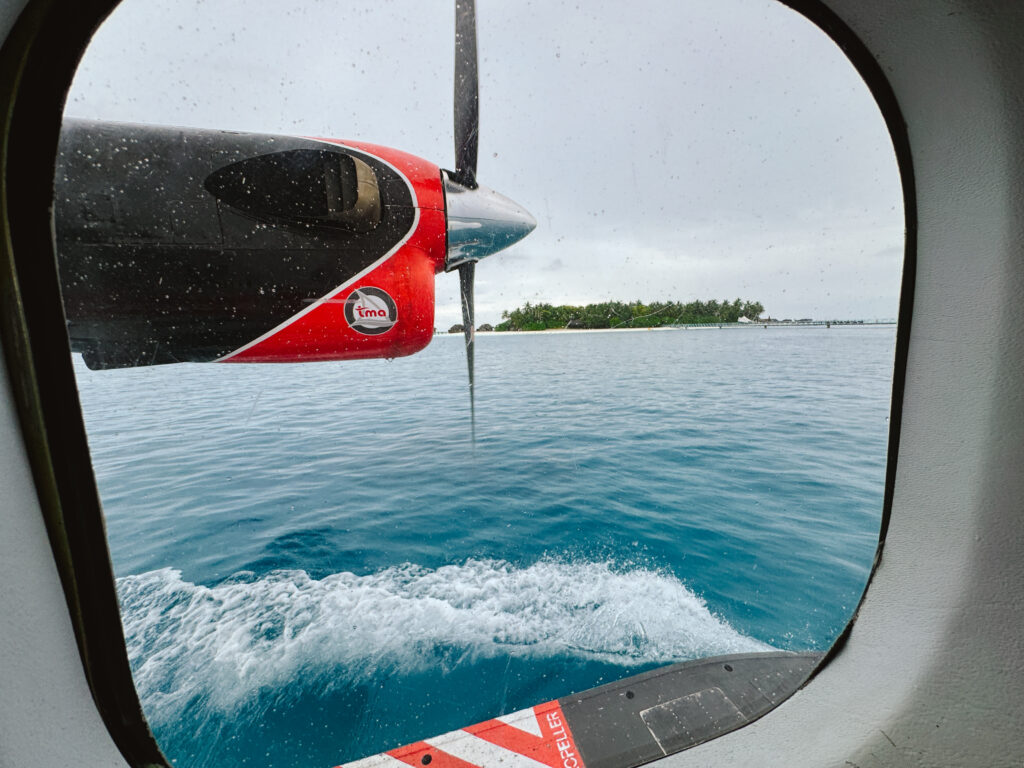 Looking out seaplane window when it's on the water and not in the air on a cloudy day
