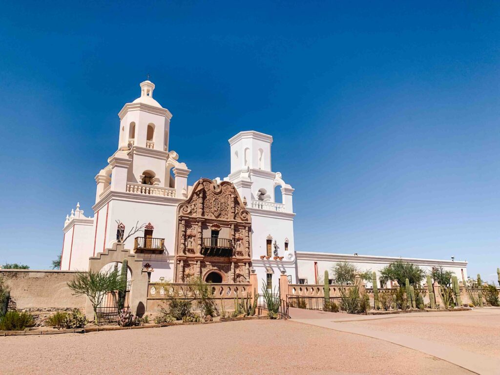 Visit Mission San Xavier del Bac, where the exterior is shown here, in Tucson, Arizona