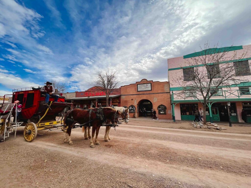 Western ghost town with period actor on a stagecoach in Tombstone, Arizona, a short day trip from Tucson